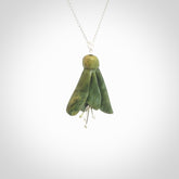 This picture shows a beautiful flower jade flower pendant with sterling silver flowers. This is a spectacular work of art and is a one off piece. Hand carved from New Zealand Flower Jade with sterling silver flowers, replicating a beautiful flower.
